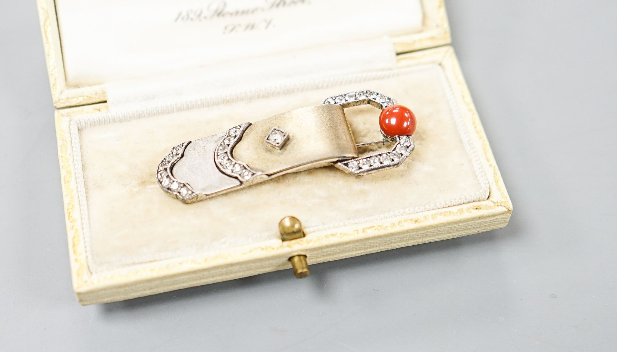 A German Art Deco 935 white metal, carnelian and white paste set clip brooch, 45mm, in Dibdin & Co leather box.